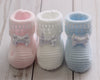 Traditional knitted baby booties with bow. Made in Spain